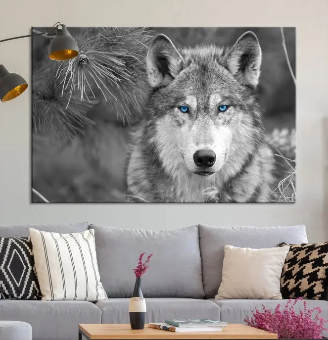 Displayed on the wall is the Wild Wolf Blue Eye Wall Art Canvas Print, a museum-quality triptych featuring a wolf with piercing blue eyes.