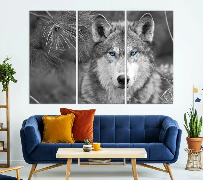 Displayed on the wall is the Wild Wolf Blue Eye Wall Art Canvas Print, a museum-quality triptych featuring a wolf with piercing blue eyes.