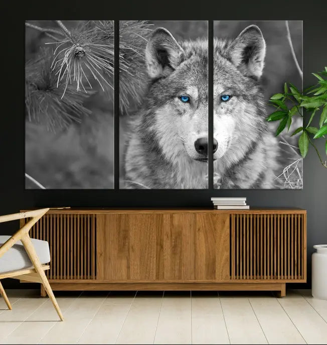 Displayed on the wall is the Wild Wolf Blue Eye Wall Art Canvas Print, a museum-quality triptych featuring a wolf with piercing blue eyes.