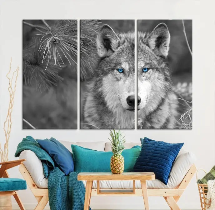 Displayed on the wall is the Wild Wolf Blue Eye Wall Art Canvas Print, a museum-quality triptych featuring a wolf with piercing blue eyes.