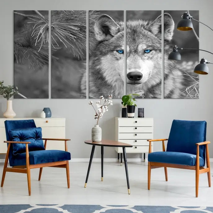 Displayed on the wall is the Wild Wolf Blue Eye Wall Art Canvas Print, a museum-quality triptych featuring a wolf with piercing blue eyes.