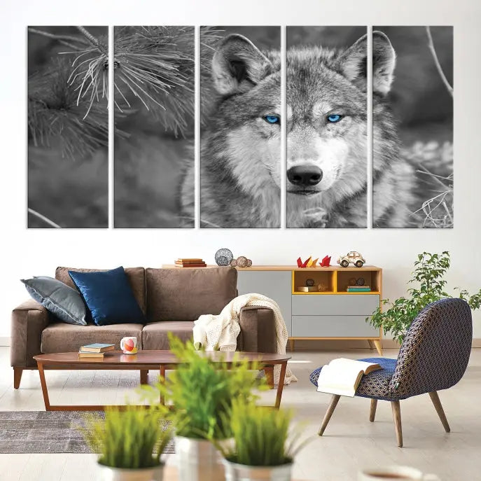 Displayed on the wall is the Wild Wolf Blue Eye Wall Art Canvas Print, a museum-quality triptych featuring a wolf with piercing blue eyes.