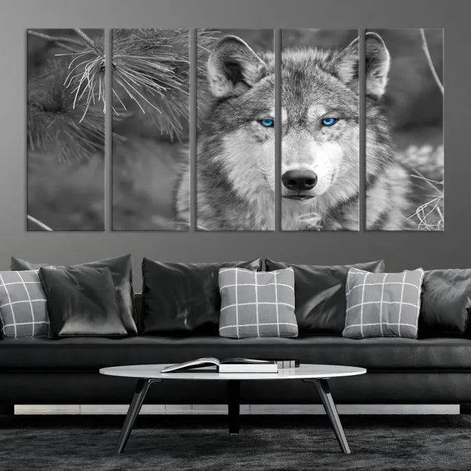 Displayed on the wall is the Wild Wolf Blue Eye Wall Art Canvas Print, a museum-quality triptych featuring a wolf with piercing blue eyes.