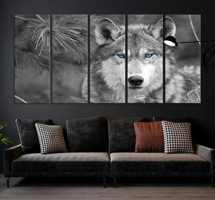 Displayed on the wall is the Wild Wolf Blue Eye Wall Art Canvas Print, a museum-quality triptych featuring a wolf with piercing blue eyes.