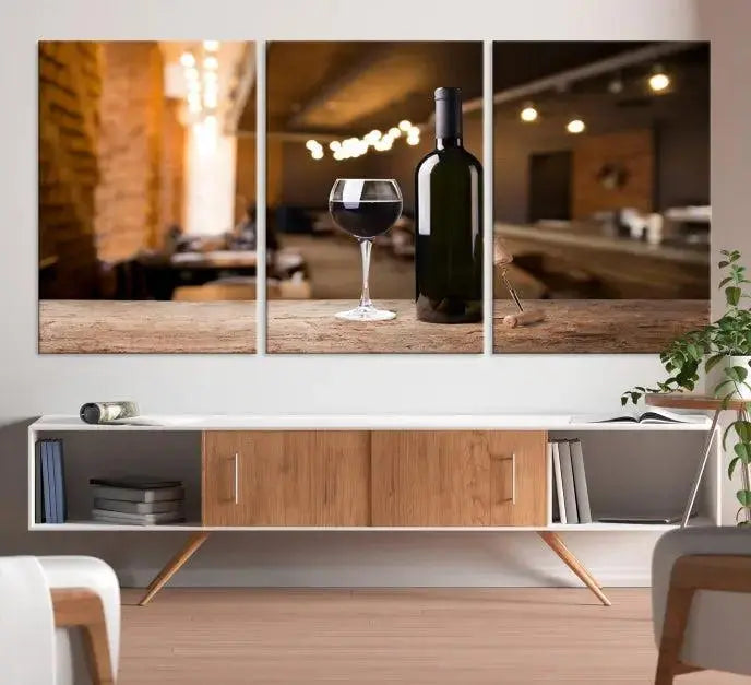 A museum-quality triptych Wall Art Canvas Print depicting a wine bottle and glass on a wooden table set against a cozy, blurred background, ready to hang.