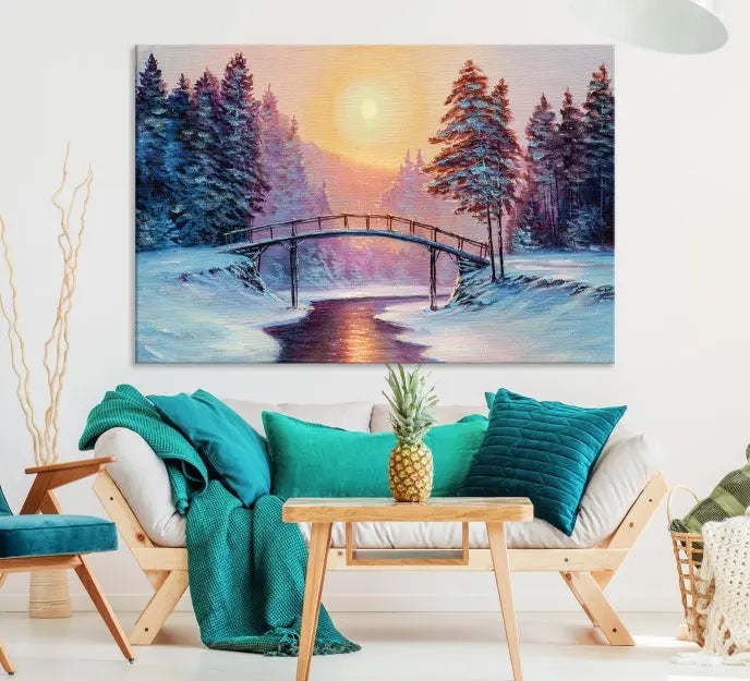 The "Winter Bridge Painting Wall Art Landscape Canvas Print" captures a serene winter landscape across three panels, showcasing a bridge, snowy trees, and a setting sun on museum-quality canvases. Each piece is gallery wrapped for an elegant finish that enhances the tranquility of the scene.