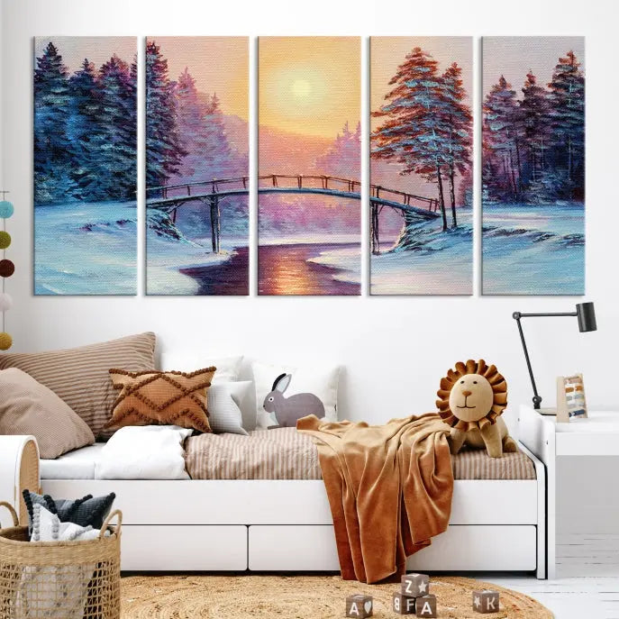 The "Winter Bridge Painting Wall Art Landscape Canvas Print" captures a serene winter landscape across three panels, showcasing a bridge, snowy trees, and a setting sun on museum-quality canvases. Each piece is gallery wrapped for an elegant finish that enhances the tranquility of the scene.