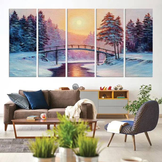 The "Winter Bridge Painting Wall Art Landscape Canvas Print" captures a serene winter landscape across three panels, showcasing a bridge, snowy trees, and a setting sun on museum-quality canvases. Each piece is gallery wrapped for an elegant finish that enhances the tranquility of the scene.