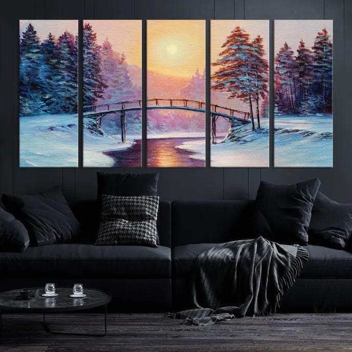 The "Winter Bridge Painting Wall Art Landscape Canvas Print" captures a serene winter landscape across three panels, showcasing a bridge, snowy trees, and a setting sun on museum-quality canvases. Each piece is gallery wrapped for an elegant finish that enhances the tranquility of the scene.