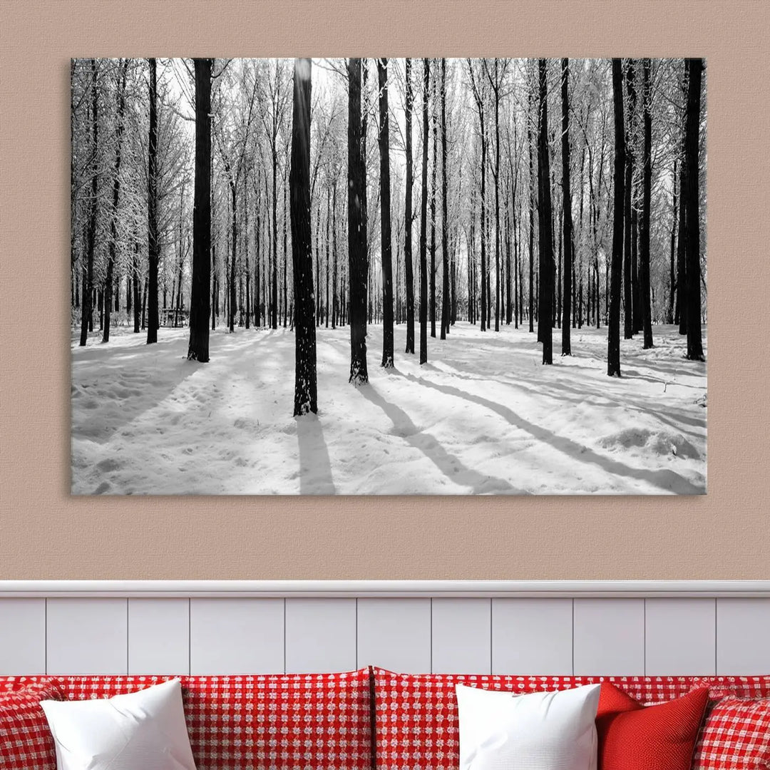 The Winter Forest Wall Art Canvas Print, featuring a snowy forest scene with a UV-protective coating, is displayed in a modern living room.