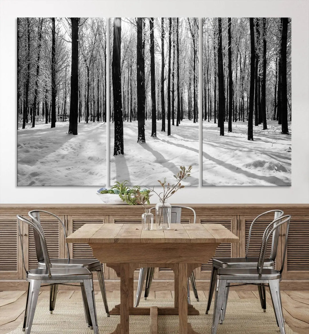 The Winter Forest Wall Art Canvas Print, featuring a snowy forest scene with a UV-protective coating, is displayed in a modern living room.