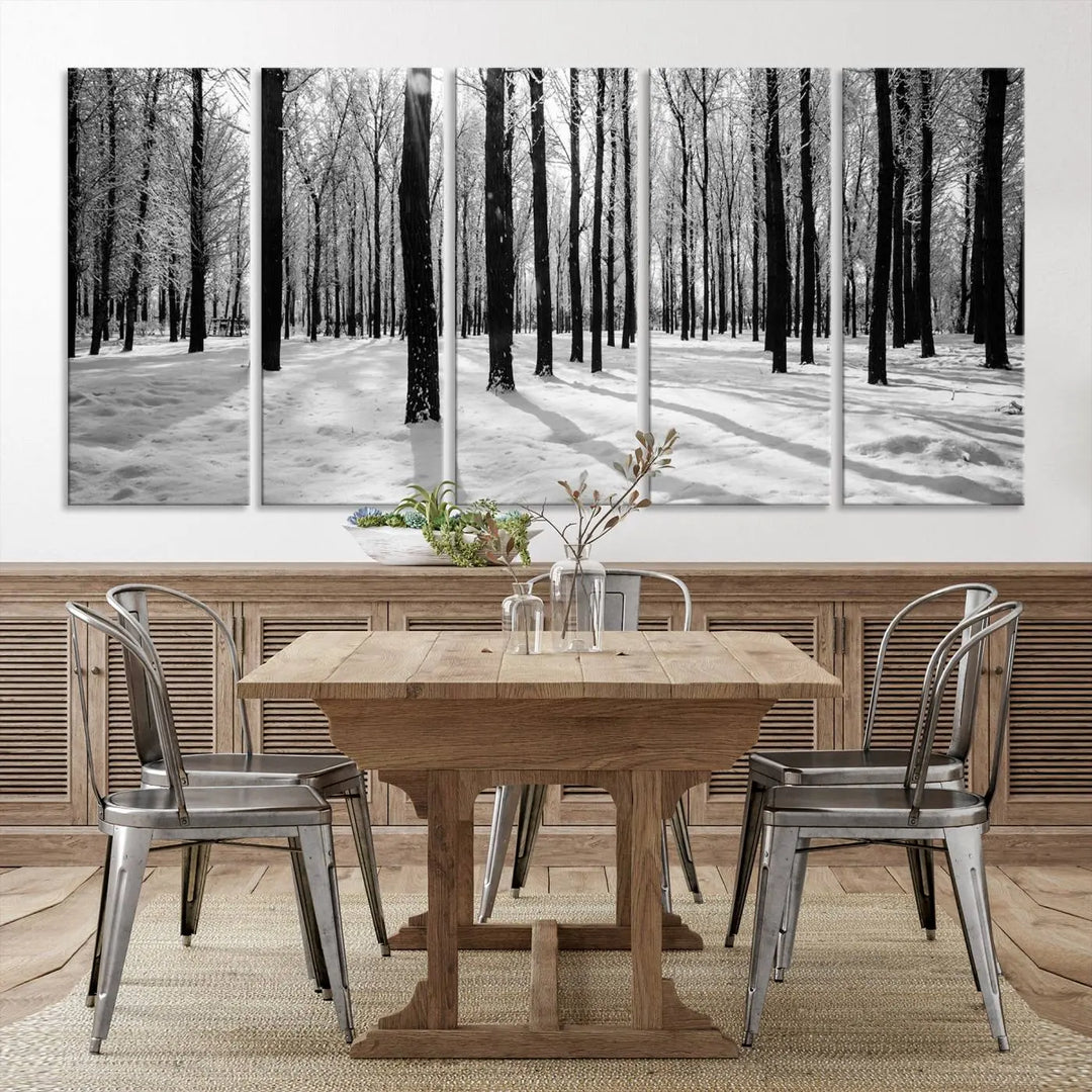 The Winter Forest Wall Art Canvas Print, featuring a snowy forest scene with a UV-protective coating, is displayed in a modern living room.