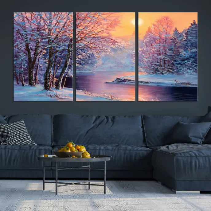 In a cozy living room, you'll find wall art titled "Winter Landscape Painting Wall Art Canvas Print," showcasing a serene snowy river scene at sunset on a museum-quality canvas with gallery-wrapped edges.