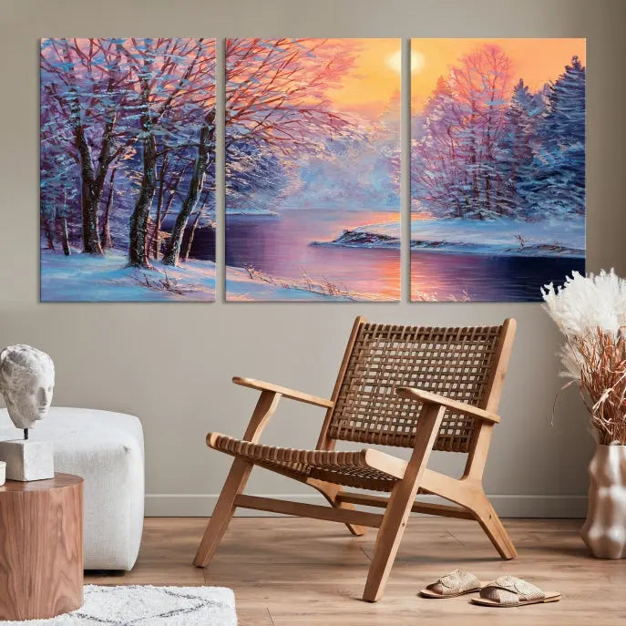 In a cozy living room, you'll find wall art titled "Winter Landscape Painting Wall Art Canvas Print," showcasing a serene snowy river scene at sunset on a museum-quality canvas with gallery-wrapped edges.