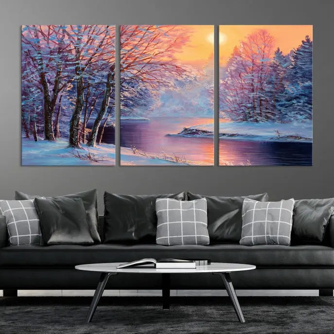 In a cozy living room, you'll find wall art titled "Winter Landscape Painting Wall Art Canvas Print," showcasing a serene snowy river scene at sunset on a museum-quality canvas with gallery-wrapped edges.