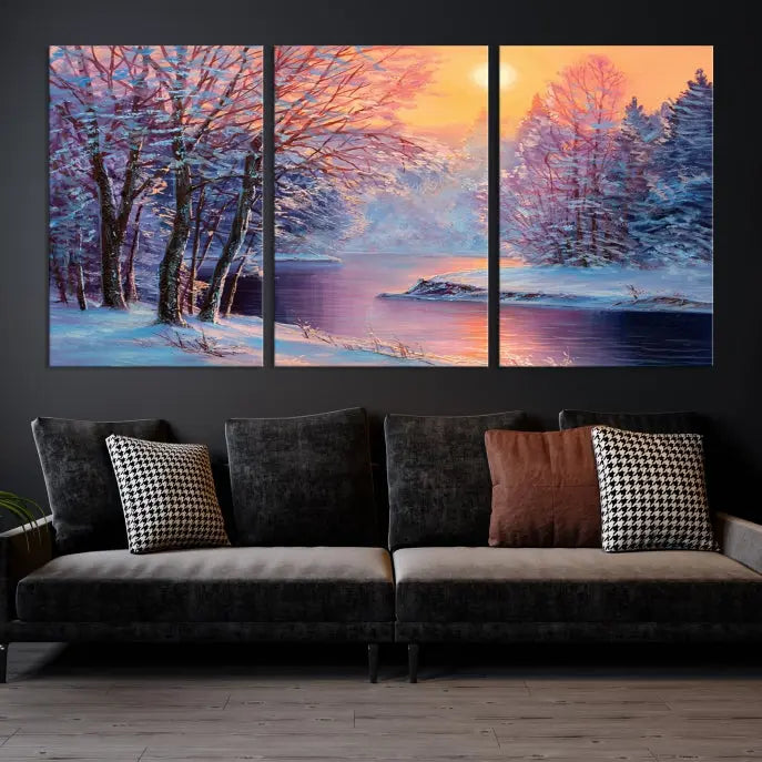 In a cozy living room, you'll find wall art titled "Winter Landscape Painting Wall Art Canvas Print," showcasing a serene snowy river scene at sunset on a museum-quality canvas with gallery-wrapped edges.