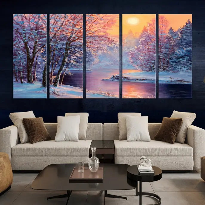 In a cozy living room, you'll find wall art titled "Winter Landscape Painting Wall Art Canvas Print," showcasing a serene snowy river scene at sunset on a museum-quality canvas with gallery-wrapped edges.