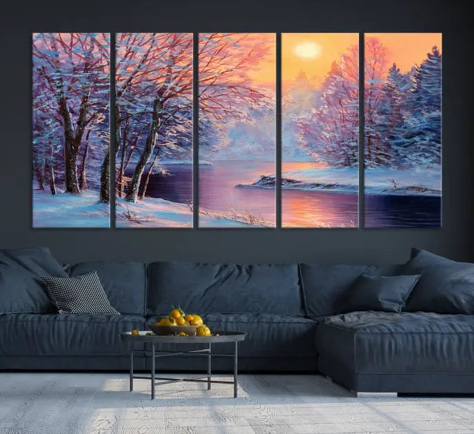 In a cozy living room, you'll find wall art titled "Winter Landscape Painting Wall Art Canvas Print," showcasing a serene snowy river scene at sunset on a museum-quality canvas with gallery-wrapped edges.