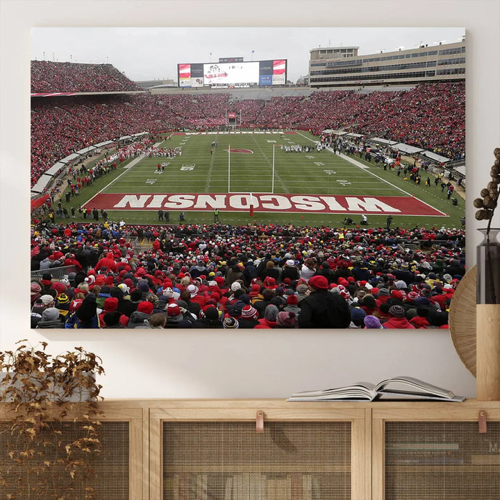 A living room exhibits the premium Wisconsin Badgers Football Team Print - Madison Camp Randall Stadium Wall Art Canvas Print, a triptych displaying an exciting game at Wisconsin. This canvas artwork infuses the space with vibrant energy.