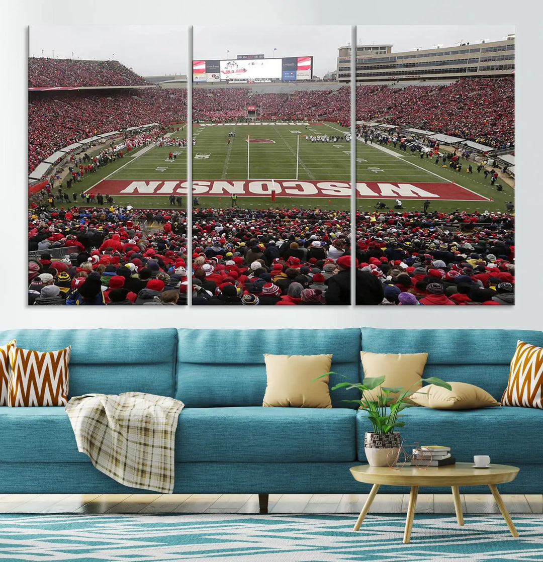 A living room exhibits the premium Wisconsin Badgers Football Team Print - Madison Camp Randall Stadium Wall Art Canvas Print, a triptych displaying an exciting game at Wisconsin. This canvas artwork infuses the space with vibrant energy.