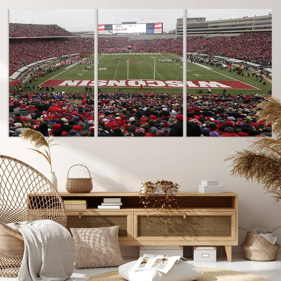 A living room exhibits the premium Wisconsin Badgers Football Team Print - Madison Camp Randall Stadium Wall Art Canvas Print, a triptych displaying an exciting game at Wisconsin. This canvas artwork infuses the space with vibrant energy.