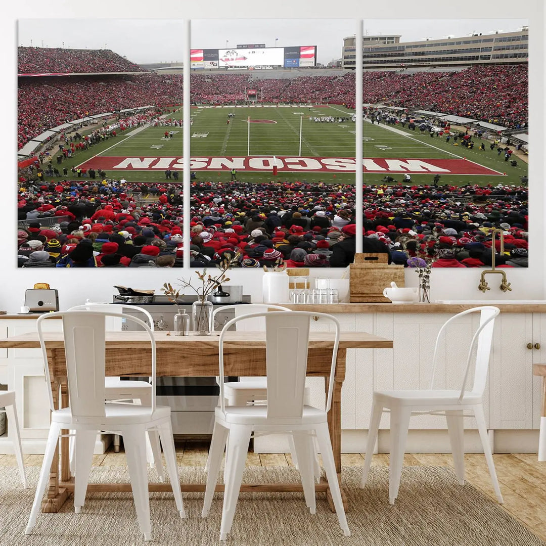 A living room exhibits the premium Wisconsin Badgers Football Team Print - Madison Camp Randall Stadium Wall Art Canvas Print, a triptych displaying an exciting game at Wisconsin. This canvas artwork infuses the space with vibrant energy.