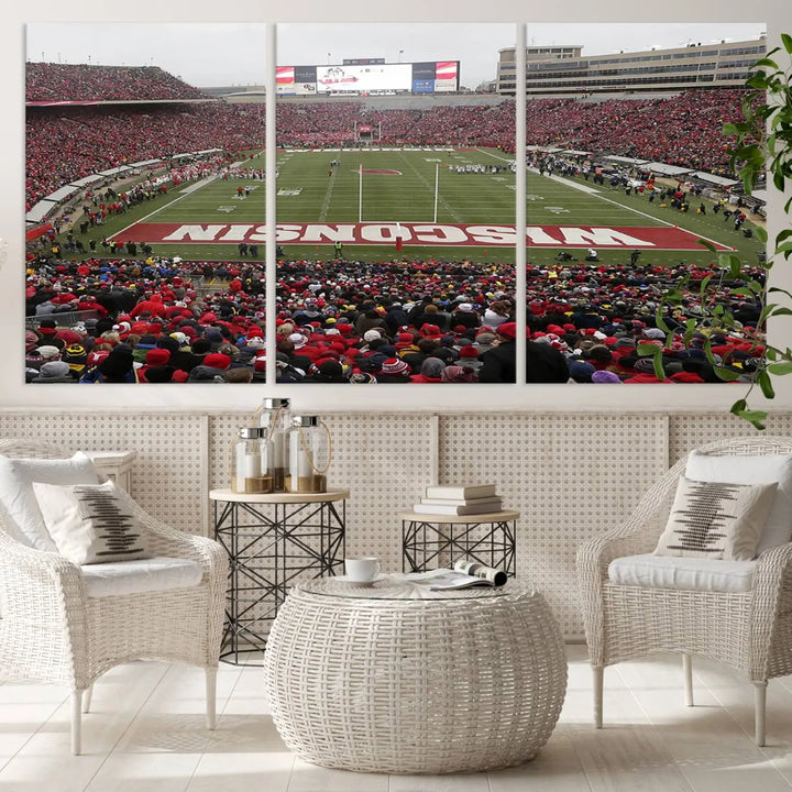 A living room exhibits the premium Wisconsin Badgers Football Team Print - Madison Camp Randall Stadium Wall Art Canvas Print, a triptych displaying an exciting game at Wisconsin. This canvas artwork infuses the space with vibrant energy.