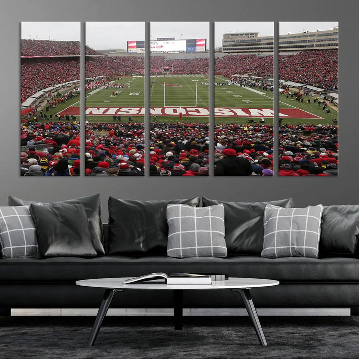 A living room exhibits the premium Wisconsin Badgers Football Team Print - Madison Camp Randall Stadium Wall Art Canvas Print, a triptych displaying an exciting game at Wisconsin. This canvas artwork infuses the space with vibrant energy.