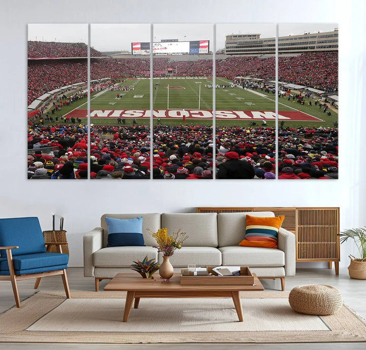 A living room exhibits the premium Wisconsin Badgers Football Team Print - Madison Camp Randall Stadium Wall Art Canvas Print, a triptych displaying an exciting game at Wisconsin. This canvas artwork infuses the space with vibrant energy.