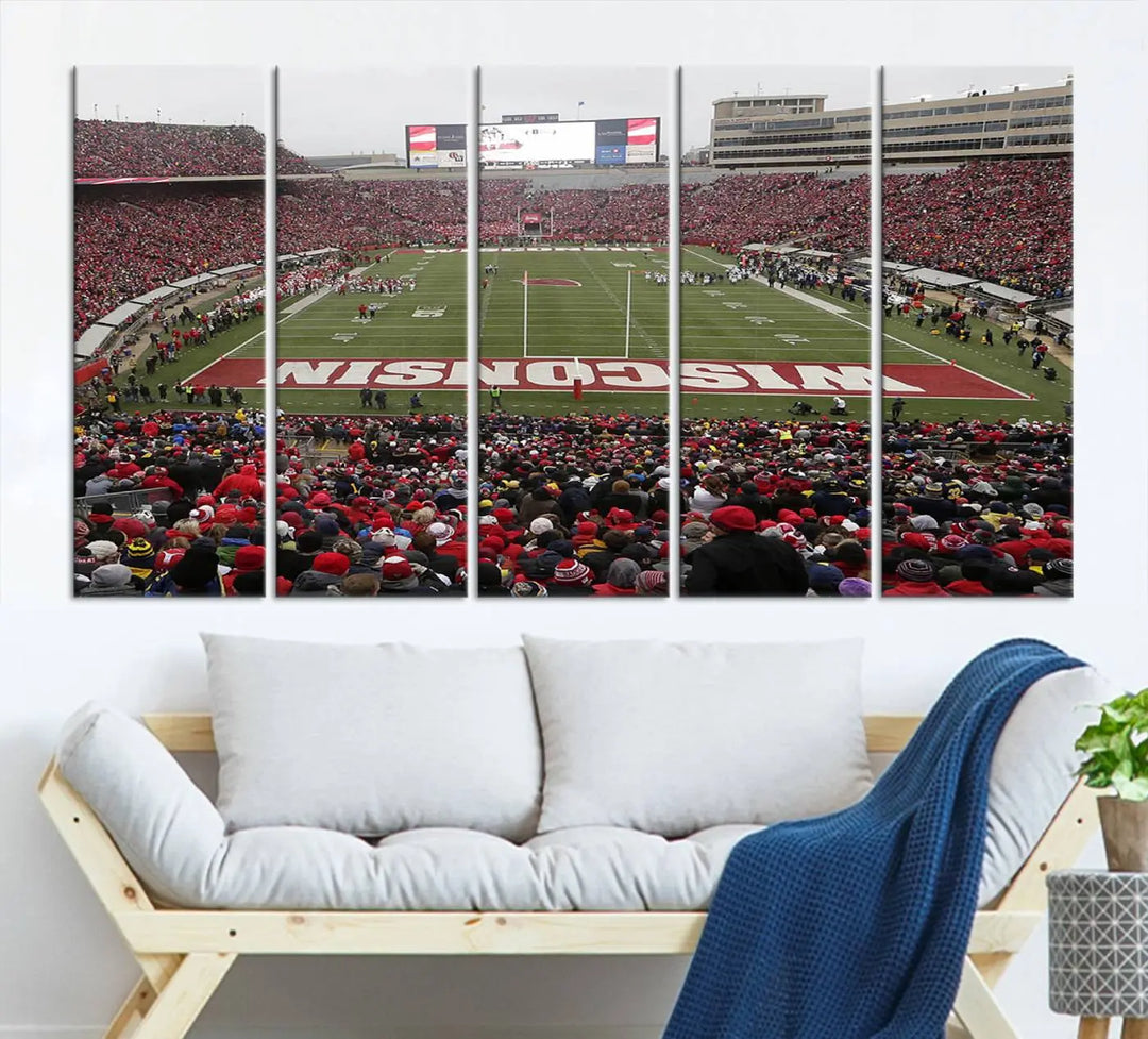 A living room exhibits the premium Wisconsin Badgers Football Team Print - Madison Camp Randall Stadium Wall Art Canvas Print, a triptych displaying an exciting game at Wisconsin. This canvas artwork infuses the space with vibrant energy.