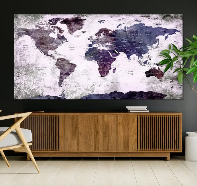 The World Map Grunge Canvas Print Wall Art, presented in five panels with a striking purple and white design, features museum-quality canvases with a gallery-wrapped finish. This treatment enhances their aesthetic appeal and ensures long-lasting durability.