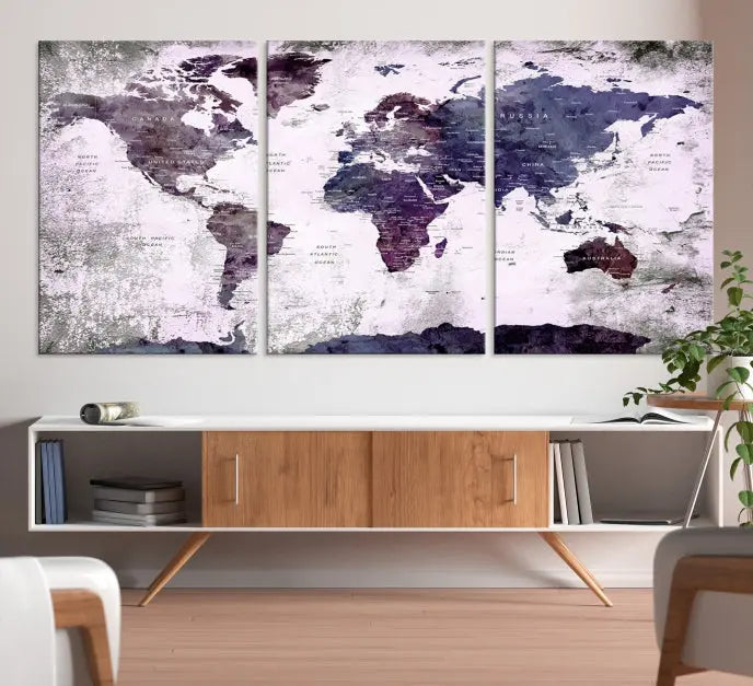 The World Map Grunge Canvas Print Wall Art, presented in five panels with a striking purple and white design, features museum-quality canvases with a gallery-wrapped finish. This treatment enhances their aesthetic appeal and ensures long-lasting durability.