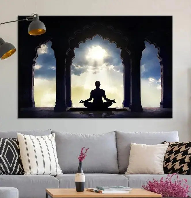 A triptych canvas print named "Women and Yoga Wall Art Canvas Print" beautifully captures a woman meditating in a temple against a backdrop of cloudy skies, showcasing graceful yoga poses. This serene artwork is displayed elegantly.