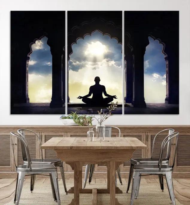 A triptych canvas print named "Women and Yoga Wall Art Canvas Print" beautifully captures a woman meditating in a temple against a backdrop of cloudy skies, showcasing graceful yoga poses. This serene artwork is displayed elegantly.