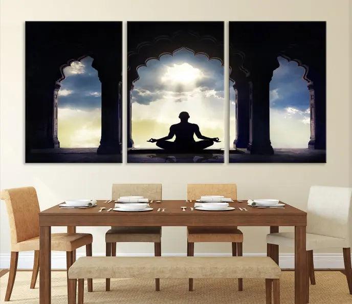 A triptych canvas print named "Women and Yoga Wall Art Canvas Print" beautifully captures a woman meditating in a temple against a backdrop of cloudy skies, showcasing graceful yoga poses. This serene artwork is displayed elegantly.