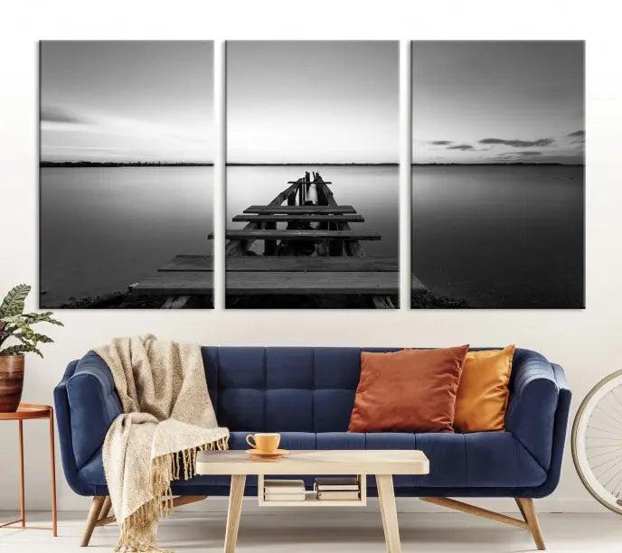 The "Wood Pier and Sea" wall art canvas print is a triptych featuring a wooden dock stretching into a serene lake, beautifully presented on gallery-wrapped museum-quality canvas.