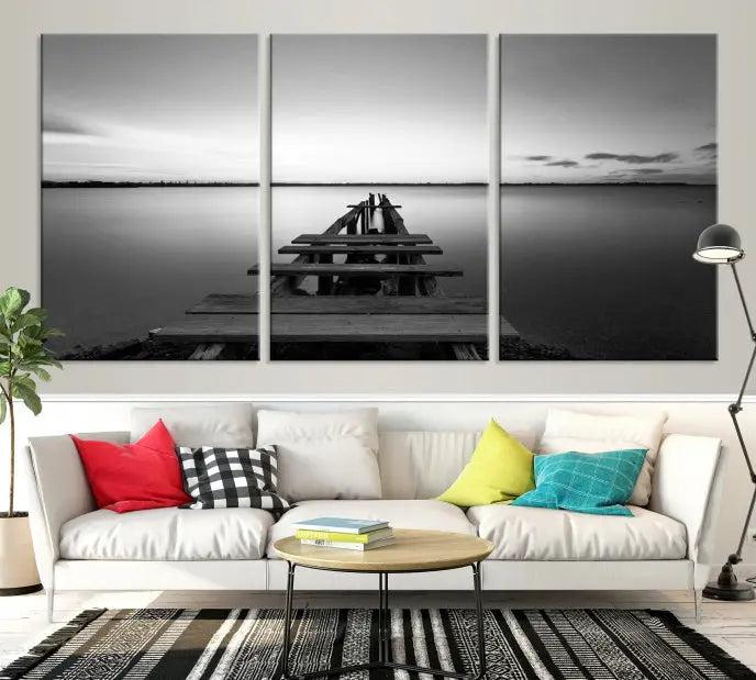 The "Wood Pier and Sea" wall art canvas print is a triptych featuring a wooden dock stretching into a serene lake, beautifully presented on gallery-wrapped museum-quality canvas.