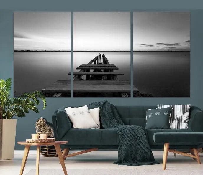 The "Wood Pier and Sea" wall art canvas print is a triptych featuring a wooden dock stretching into a serene lake, beautifully presented on gallery-wrapped museum-quality canvas.