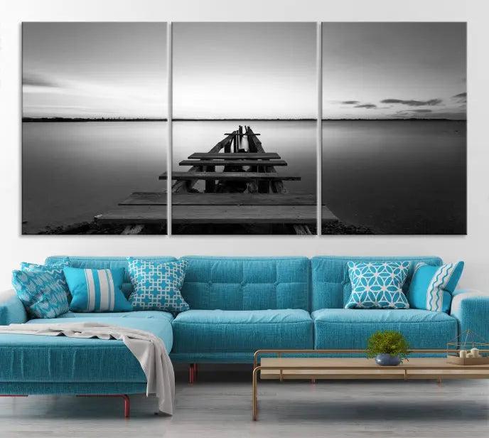 The "Wood Pier and Sea" wall art canvas print is a triptych featuring a wooden dock stretching into a serene lake, beautifully presented on gallery-wrapped museum-quality canvas.