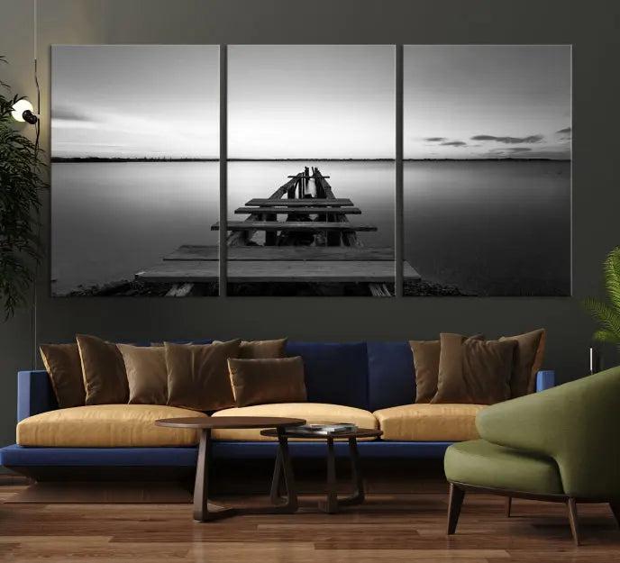 The "Wood Pier and Sea" wall art canvas print is a triptych featuring a wooden dock stretching into a serene lake, beautifully presented on gallery-wrapped museum-quality canvas.