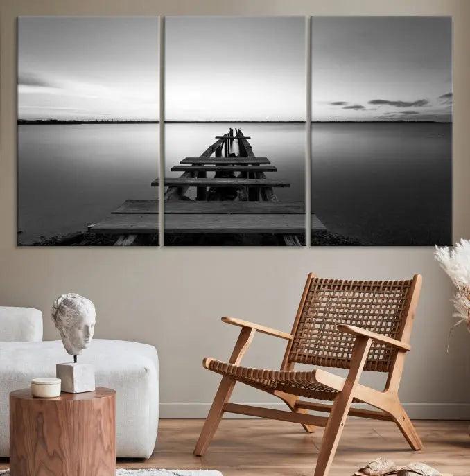 The "Wood Pier and Sea" wall art canvas print is a triptych featuring a wooden dock stretching into a serene lake, beautifully presented on gallery-wrapped museum-quality canvas.