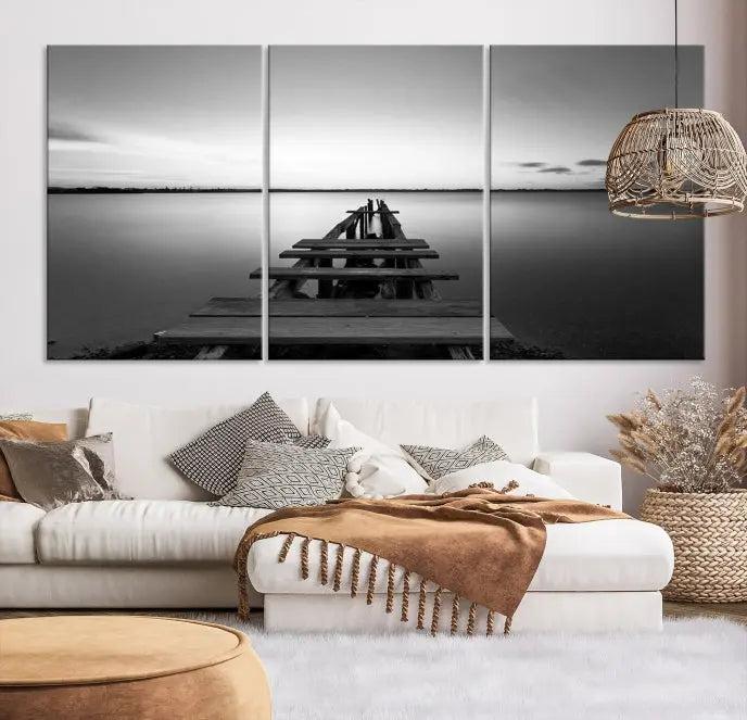 The "Wood Pier and Sea" wall art canvas print is a triptych featuring a wooden dock stretching into a serene lake, beautifully presented on gallery-wrapped museum-quality canvas.