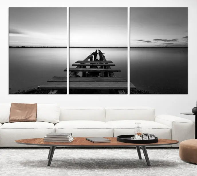 The "Wood Pier and Sea" wall art canvas print is a triptych featuring a wooden dock stretching into a serene lake, beautifully presented on gallery-wrapped museum-quality canvas.