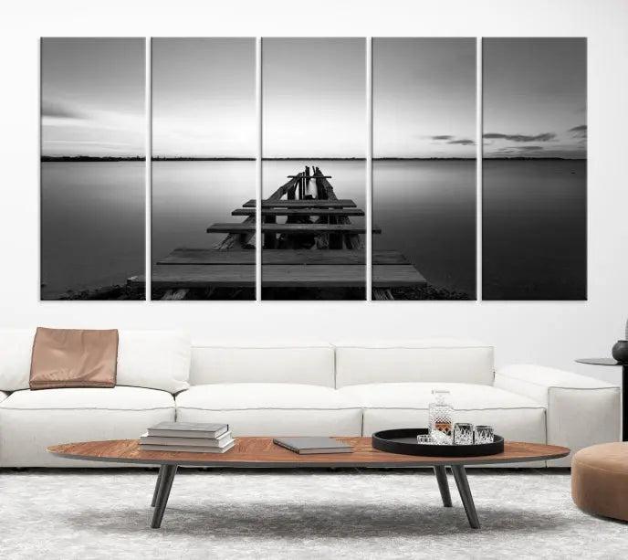 The "Wood Pier and Sea" wall art canvas print is a triptych featuring a wooden dock stretching into a serene lake, beautifully presented on gallery-wrapped museum-quality canvas.