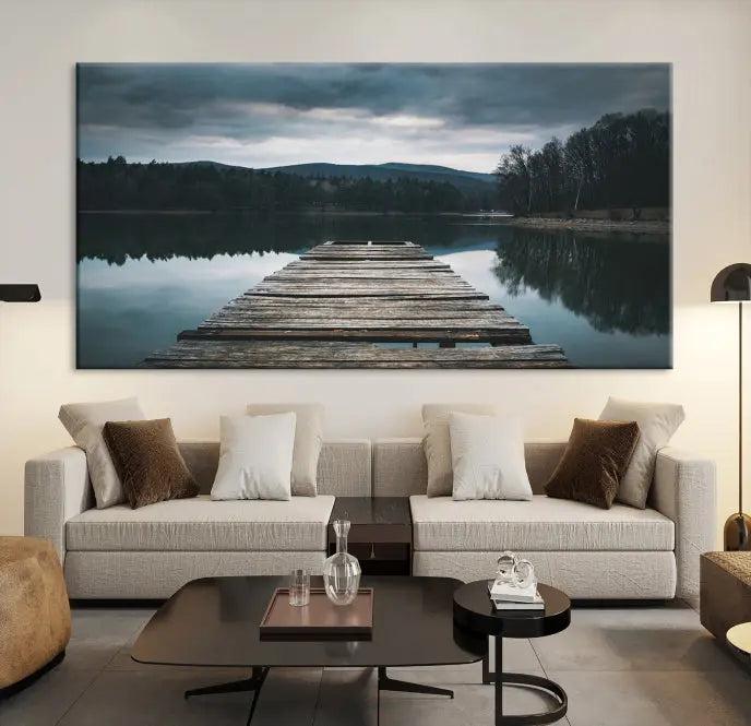 A serene triptych featuring the "Wooden Bridge Near Lake Wall Art Canvas Print" is showcased, depicting a tranquil lake with a wooden pier amidst trees and mountains on museum-quality canvas.