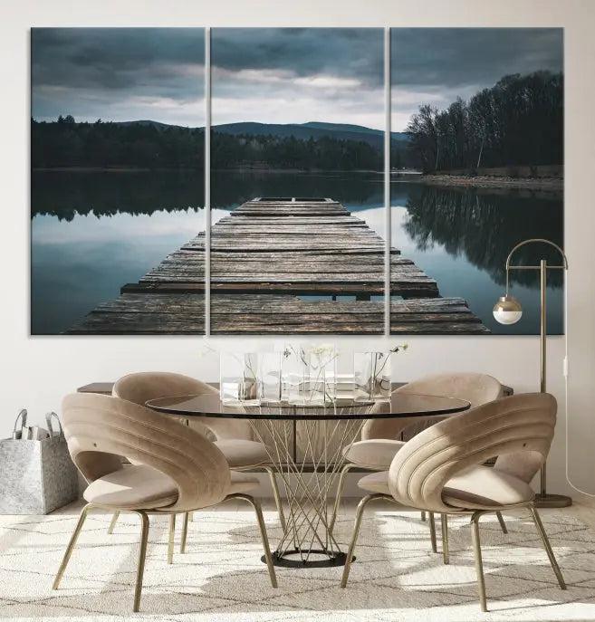 A serene triptych featuring the "Wooden Bridge Near Lake Wall Art Canvas Print" is showcased, depicting a tranquil lake with a wooden pier amidst trees and mountains on museum-quality canvas.