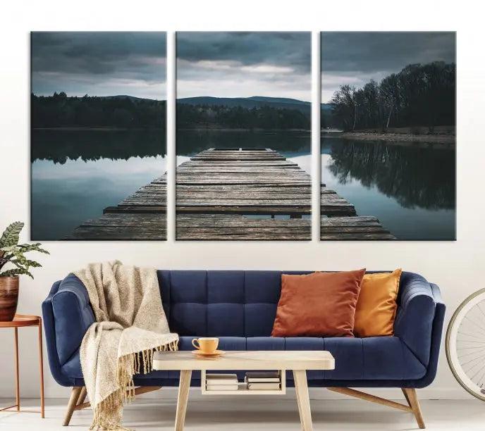 A serene triptych featuring the "Wooden Bridge Near Lake Wall Art Canvas Print" is showcased, depicting a tranquil lake with a wooden pier amidst trees and mountains on museum-quality canvas.