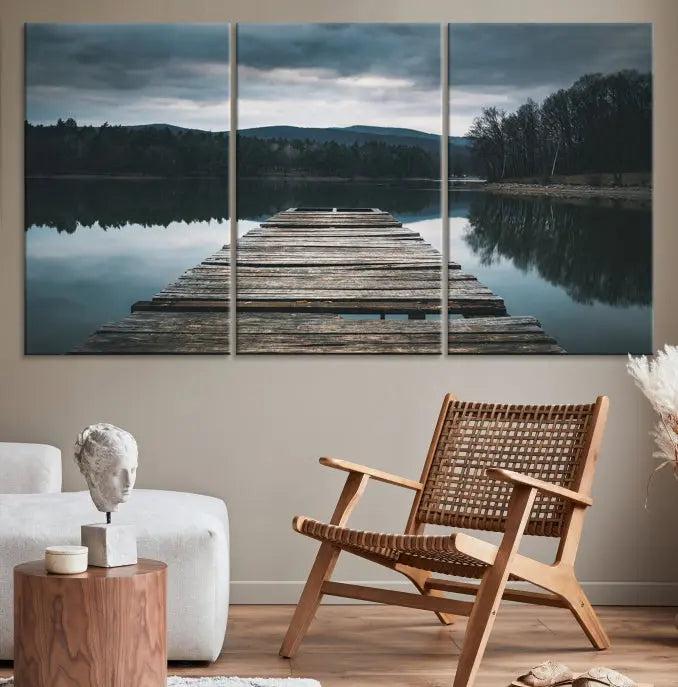 A serene triptych featuring the "Wooden Bridge Near Lake Wall Art Canvas Print" is showcased, depicting a tranquil lake with a wooden pier amidst trees and mountains on museum-quality canvas.