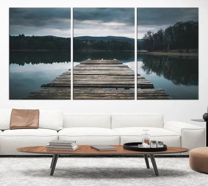 A serene triptych featuring the "Wooden Bridge Near Lake Wall Art Canvas Print" is showcased, depicting a tranquil lake with a wooden pier amidst trees and mountains on museum-quality canvas.