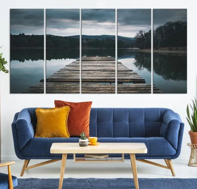 A serene triptych featuring the "Wooden Bridge Near Lake Wall Art Canvas Print" is showcased, depicting a tranquil lake with a wooden pier amidst trees and mountains on museum-quality canvas.